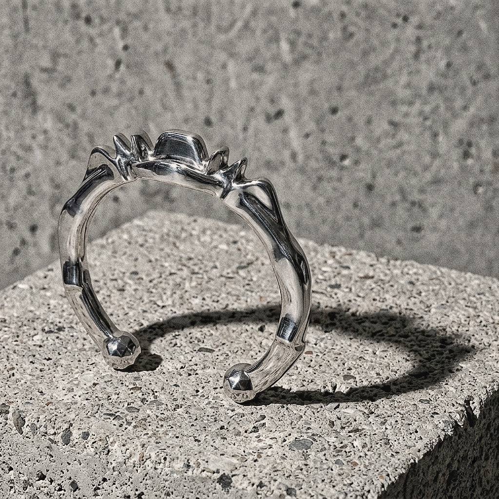 Solid sterling silver cuff showing the sustained ridge of peaks along the upper edge, 925 silver