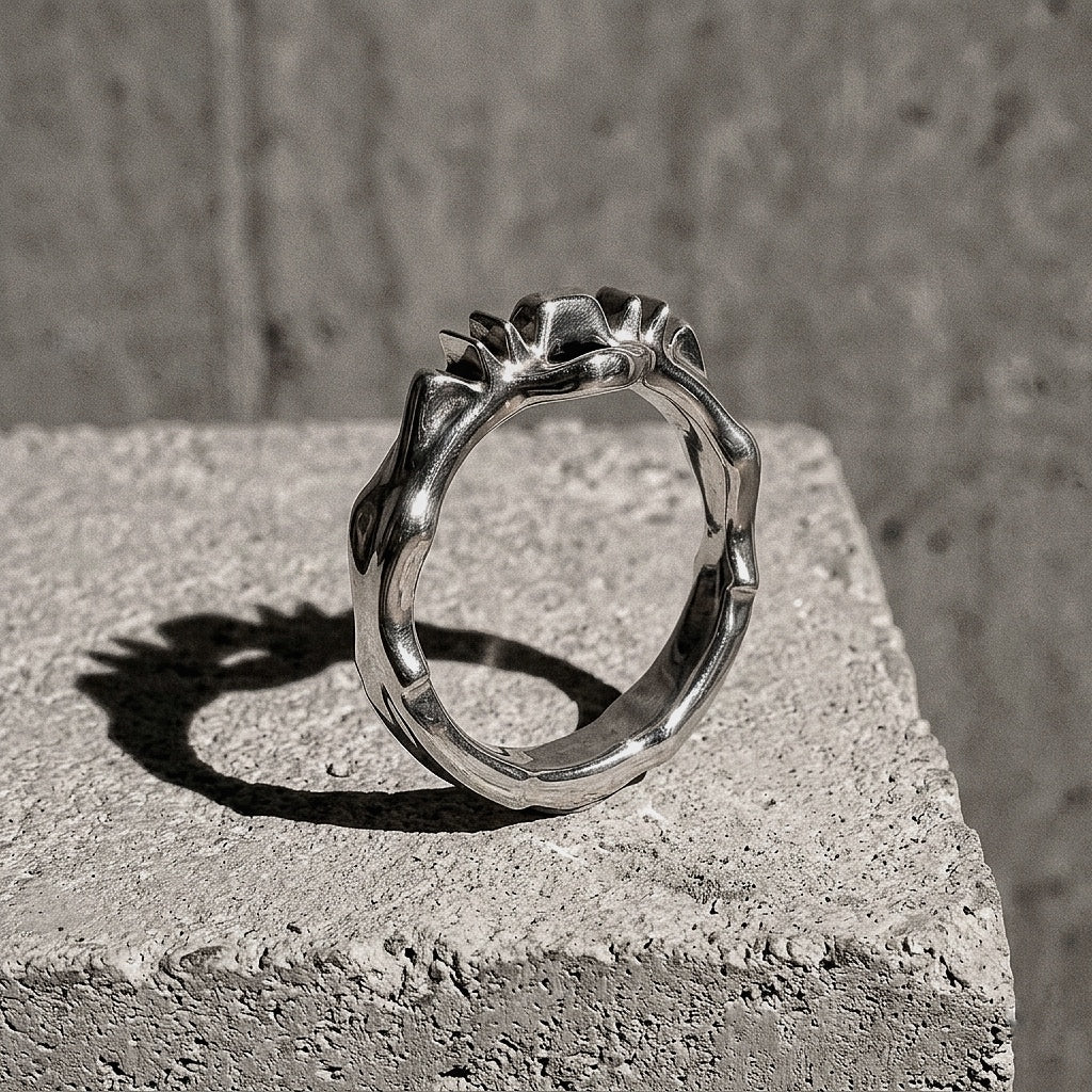 Sterling silver ring showing irregular crown with stepped ridges and arched forms, 925 silver