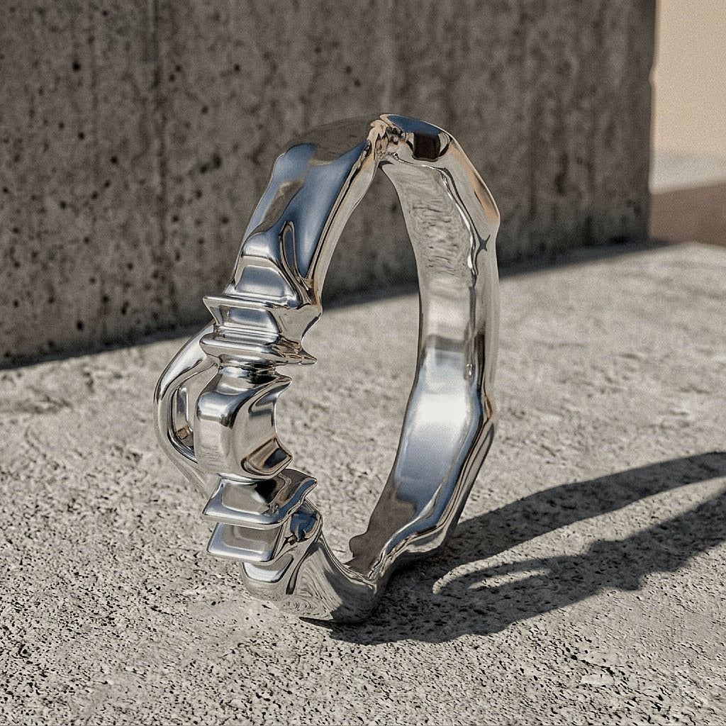 Polished sterling silver ring revealing depth of architectural composition at the crown