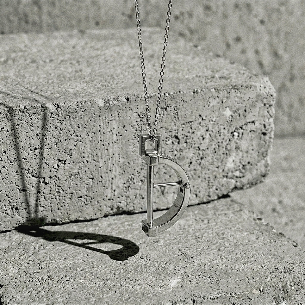 Sterling silver half-bangle suspended from framed bail, showing the three parallel bands and riveted vertices, 925 silver
