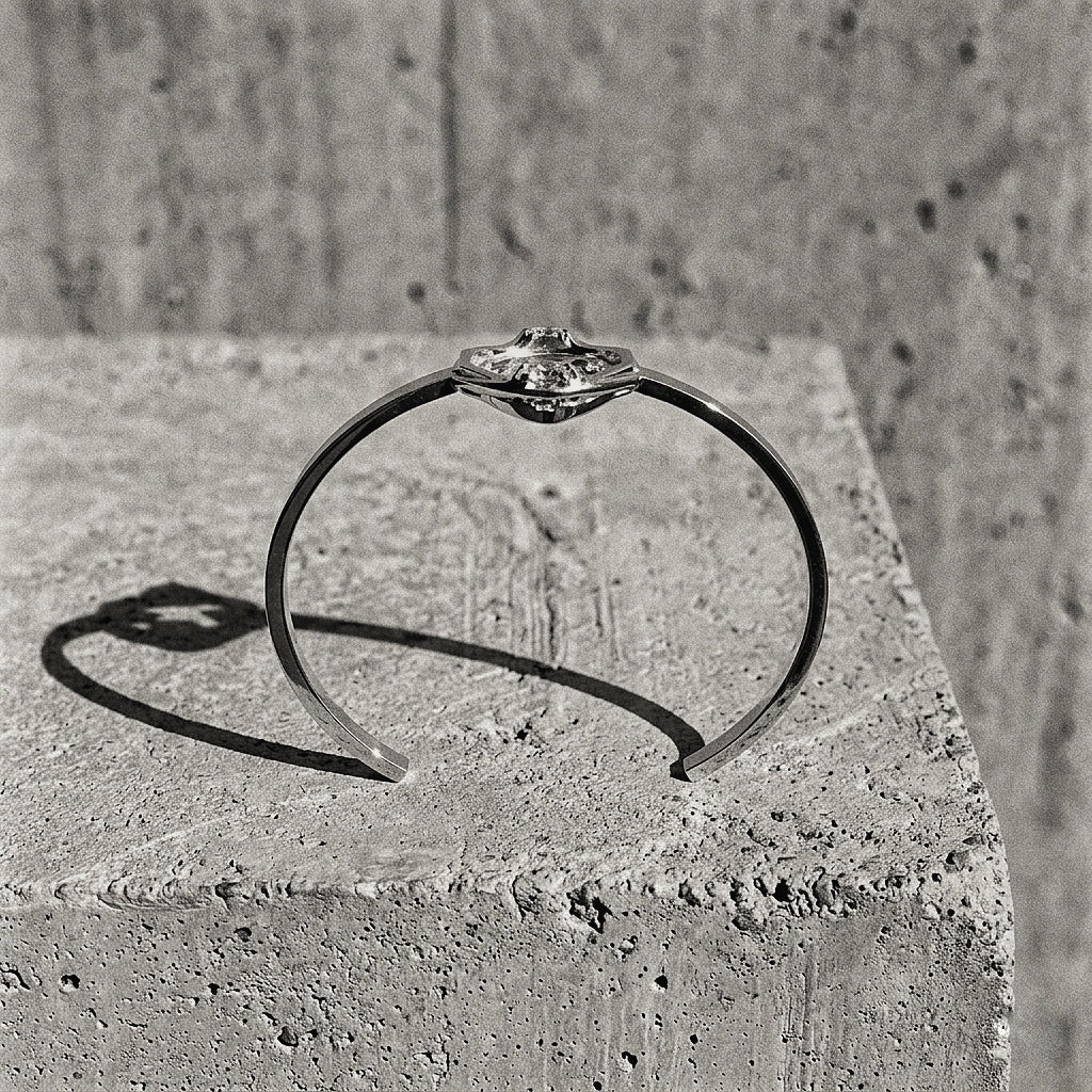 Solid sterling silver cuff with twin bands and central Spiked module on concrete pedestal