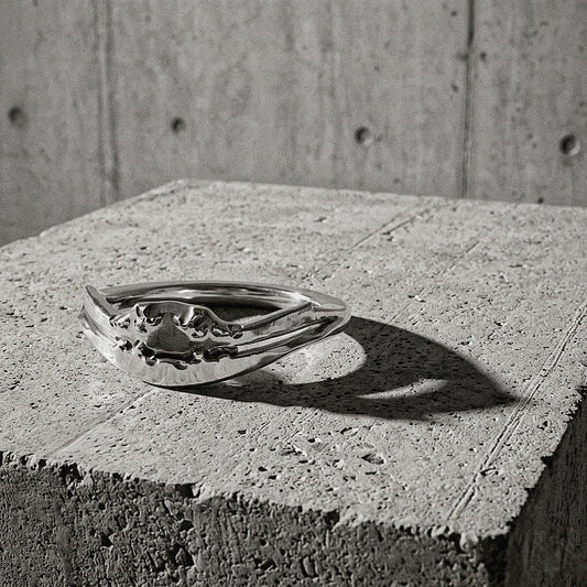 Textured ring with organic raised ridge at the crown on concrete surface, A Gross Domestic Product