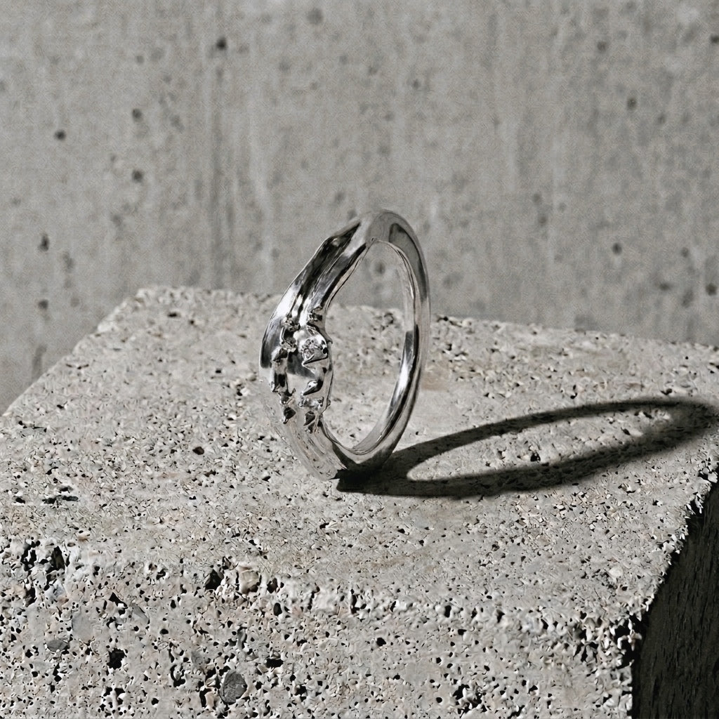 Silver ring with raised organic ridge rising from flat polished band, (A) Symmetry collection