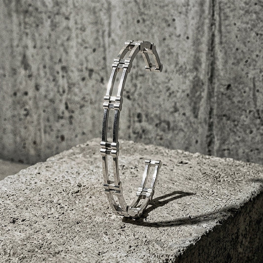6mm wide open cuff standing on concrete, A Gross Domestic Product