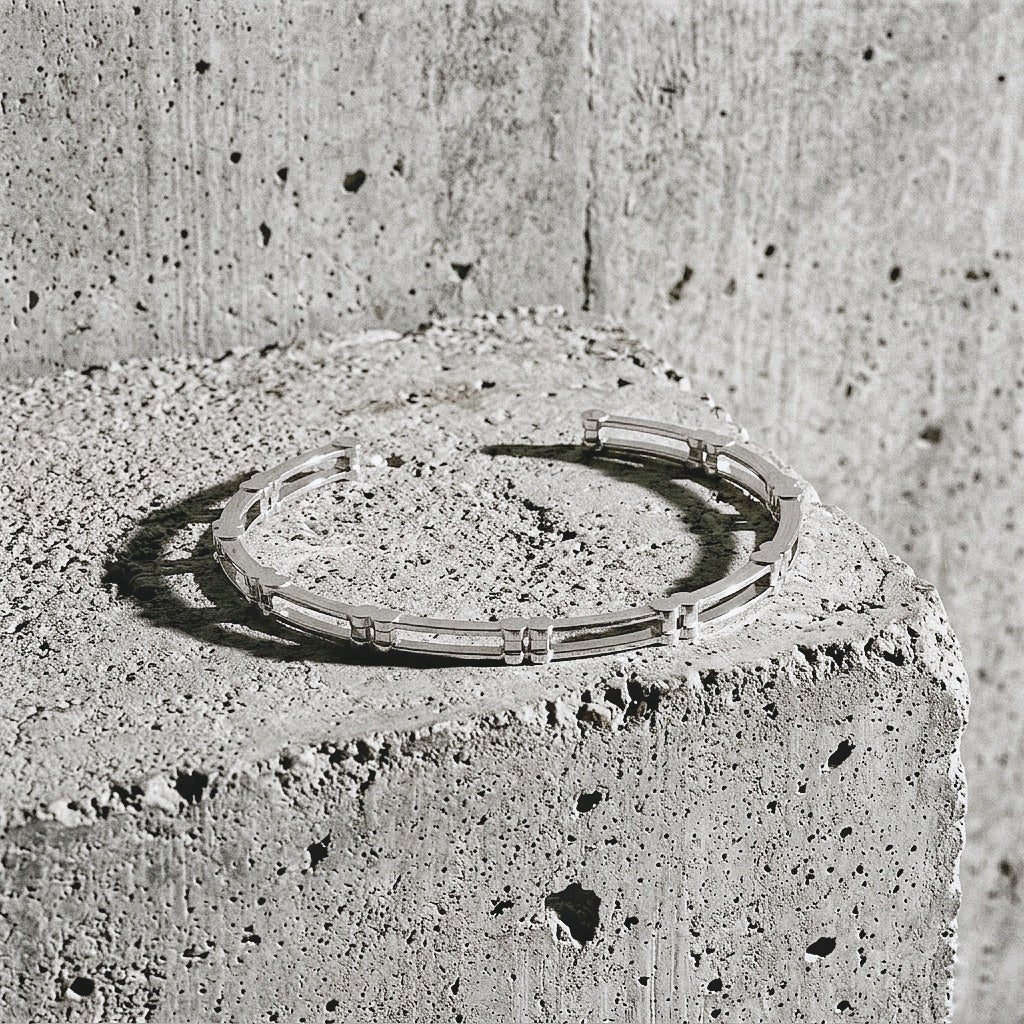 Ten Cuff Bracelet in sterling silver — top view on concrete surface, Link collection